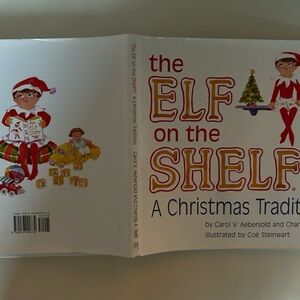 Elf on the shelf book (only). Written inside front cover…